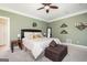 Inviting bedroom features a ceiling fan and neutral color scheme at 207 Jamestown Ave, Jonesboro, GA 30236