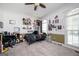 A teenager's bedroom with posters, decorative shelves, and a bed by the window, creating a cozy and personalized space at 207 Jamestown Ave, Jonesboro, GA 30236