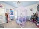 Whimsical bedroom with a canopy bed, soft carpet, rainbow window and a cheerful design at 207 Jamestown Ave, Jonesboro, GA 30236