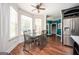 Dining room featuring hardwood floors, large windows, and a view of the kitchen area at 207 Jamestown Ave, Jonesboro, GA 30236