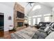 Spacious living room featuring a stone fireplace, vaulted ceilings, lots of windows and comfortable seating at 207 Jamestown Ave, Jonesboro, GA 30236