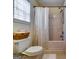 Simple bathroom featuring tile flooring and white shower curtain at 7750 Carnegie Dr, Fairburn, GA 30213