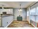 Bright dining area featuring hardwood floors and plenty of natural light at 7750 Carnegie Dr, Fairburn, GA 30213