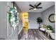 Welcoming foyer with stylish gray walls, wood flooring, and lovely front door wreath at 7750 Carnegie Dr, Fairburn, GA 30213