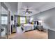 Large bedroom with tray ceilings, large windows, and neutral decor at 7750 Carnegie Dr, Fairburn, GA 30213