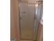 Bathroom shower has a glass door and tile surround with a built-in soap dish at 7541 Coddington Ct, Riverdale, GA 30274