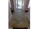 Inviting foyer with decorative tile flooring, and view of the front door at 7541 Coddington Ct, Riverdale, GA 30274