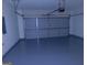 View of the painted two car garage with an epoxy floor at 7541 Coddington Ct, Riverdale, GA 30274