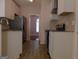 Modern kitchen featuring white cabinets, granite countertops, and stainless steel appliances at 7541 Coddington Ct, Riverdale, GA 30274