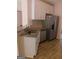 Modern kitchen featuring white cabinets, granite countertops, stainless steel appliances, and a sink at 7541 Coddington Ct, Riverdale, GA 30274