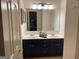 Bathroom with a double sink vanity and a view into the bedroom at 514 Augusta Dr, Canton, GA 30115