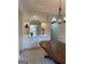 Dining area boasts custom built-in cabinetry with glass display shelving and stylish chandelier for elegant entertaining at 514 Augusta Dr, Canton, GA 30115