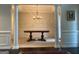 Dining room with elegant columns, traditional wainscoting, and a chandelier providing a warm and welcoming ambiance at 514 Augusta Dr, Canton, GA 30115