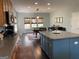 Spacious kitchen with a center island, wood cabinets, and stainless steel appliances, provides a functional and stylish cooking space at 514 Augusta Dr, Canton, GA 30115