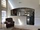 Inviting living area showcasing a large window looking into the adjacent kitchen space with stainless steel appliances at 514 Augusta Dr, Canton, GA 30115