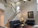 Spacious living room featuring a staircase, high ceilings, and large windows providing ample natural light at 514 Augusta Dr, Canton, GA 30115