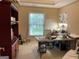 Home office featuring a large desk and a view of the neighborhood at 514 Augusta Dr, Canton, GA 30115