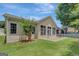 Well-maintained backyard featuring a patio and green lawn, providing a serene setting for outdoor enjoyment at 203 Collierstown Way, Peachtree City, GA 30269