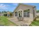 Spacious patio with outdoor seating, perfect for entertaining, and lush green lawn, creating an inviting outdoor space at 203 Collierstown Way, Peachtree City, GA 30269