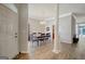 Dining room view showcasing hardwood floors, ample lighting and architectural column at 203 Collierstown Way, Peachtree City, GA 30269
