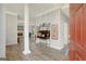 Open foyer with hardwood floors, decorative furnishings and views into the living room at 203 Collierstown Way, Peachtree City, GA 30269