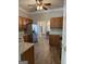 Open concept kitchen with wood cabinetry, stainless steel refrigerator, and easy access to dining area at 203 Collierstown Way, Peachtree City, GA 30269