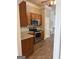 Kitchen features wood cabinets, stainless steel appliances, and granite countertops at 203 Collierstown Way, Peachtree City, GA 30269