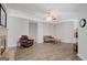 Bright living room with hardwood floors, fireplace and neutral wall color at 203 Collierstown Way, Peachtree City, GA 30269