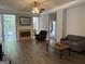 Spacious living room with fireplace, ceiling fan, hardwood floors, and neutral paint at 203 Collierstown Way, Peachtree City, GA 30269