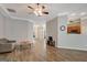 Spacious living room with hardwood floors, ceiling fan and open floor plan at 203 Collierstown Way, Peachtree City, GA 30269