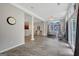 Open living room with hardwood floors, neutral wall color and easy access to the kitchen and sunroom at 203 Collierstown Way, Peachtree City, GA 30269