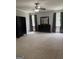Spacious main bedroom with neutral walls and large windows at 203 Collierstown Way, Peachtree City, GA 30269