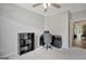 Well-lit office area with carpet, ceiling fan, open closet space, and black desk at 203 Collierstown Way, Peachtree City, GA 30269