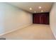 Unfinished basement with neutral walls and carpet, illuminated with recessed lighting at 6205 Collingham Trce, Cumming, GA 30040