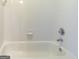 Bathroom features a white tiled shower and tub at 6205 Collingham Trce, Cumming, GA 30040