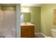 Bathroom with walk in shower, vanity with storage, and neutral countertops at 6205 Collingham Trce, Cumming, GA 30040