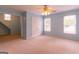 Light blue bedroom includes two windows and a ceiling fan at 6205 Collingham Trce, Cumming, GA 30040