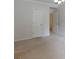 Spacious bedroom featuring neutral carpeting, white doors, trim and ceiling fan at 6205 Collingham Trce, Cumming, GA 30040