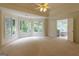 Expansive main bedroom filled with natural light from many windows with a door leading to an ensuite bathroom at 6205 Collingham Trce, Cumming, GA 30040