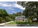 Charming two-story home with a manicured lawn and well-maintained landscaping, creating a welcoming curb appeal at 6205 Collingham Trce, Cumming, GA 30040