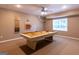 Game room featuring a pool table, window, ceiling fan and shelving at 6205 Collingham Trce, Cumming, GA 30040