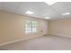Basement space with drop ceiling tiles, neutral paint, and a window for natural light at 130 Gillson Dr, Mcdonough, GA 30253