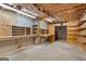 Unfinished basement with shelves, providing ample storage and workspace potential at 130 Gillson Dr, Mcdonough, GA 30253