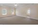 Spacious carpeted bedroom with a ceiling fan and windows for natural light at 130 Gillson Dr, Mcdonough, GA 30253