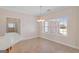 Dining area is naturally lit with a chandelier and a large window at 130 Gillson Dr, Mcdonough, GA 30253