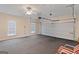 Spacious garage with two windows, ceiling fan, and garage door with automatic opener at 130 Gillson Dr, Mcdonough, GA 30253