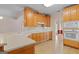 Kitchen features wood cabinetry, a white countertop and white appliances at 130 Gillson Dr, Mcdonough, GA 30253