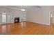 Elegant living room featuring hardwood flooring, fireplace, and French doors at 130 Gillson Dr, Mcdonough, GA 30253
