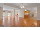 Open-concept living space with hardwood floors, natural light, and access to kitchen at 130 Gillson Dr, Mcdonough, GA 30253