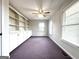 Bedroom with built-in cabinets, neutral paint, and carpet. Well-lit by natural light through the two windows at 238 Marks Rd, Mansfield, GA 30055